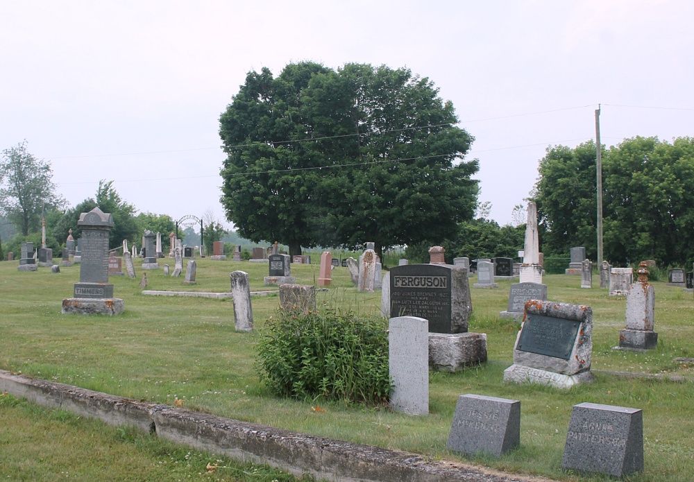 Historic Zion Cemetery with mature tree and vintage headstones